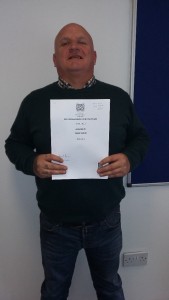 Tommy with his SVQ 2 Social Services and Health Care qualification